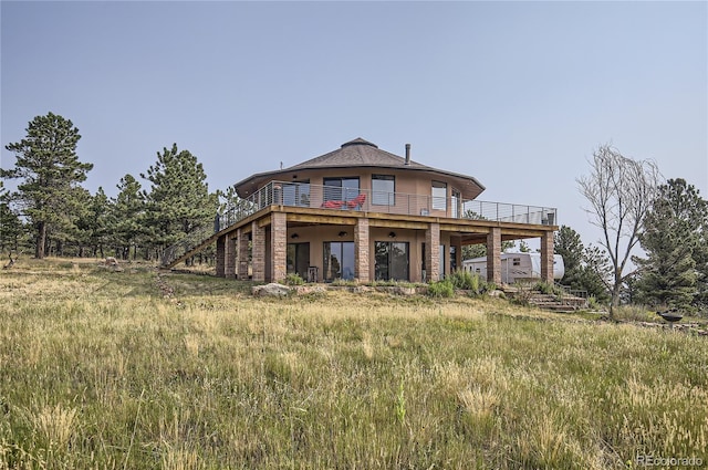 back of property featuring a deck