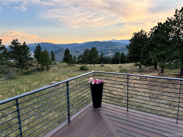 3001 Eagle Ridge Rd, Longmont, CO 80503 - deck at dusk with a mountain view