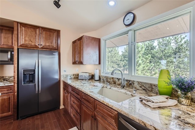 3001 Eagle Ridge Rd, Longmont, CO 80503 - kitchen featuring stainless steel fridge, black microwave, a sink, light stone counters, and dark wood-style floors