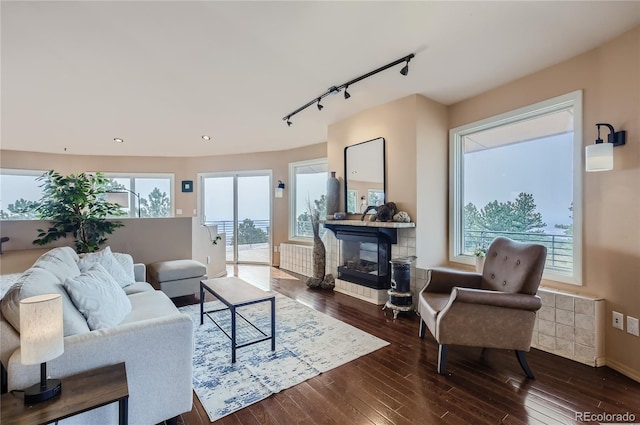 3001 Eagle Ridge Rd, Longmont, CO 80503 - living room with track lighting, hardwood / wood-style flooring, plenty of natural light, and recessed lighting