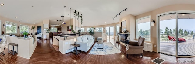 3001 Eagle Ridge Rd, Longmont, CO 80503 - living area featuring dark wood-type flooring, healthy amount of natural light, and track lighting