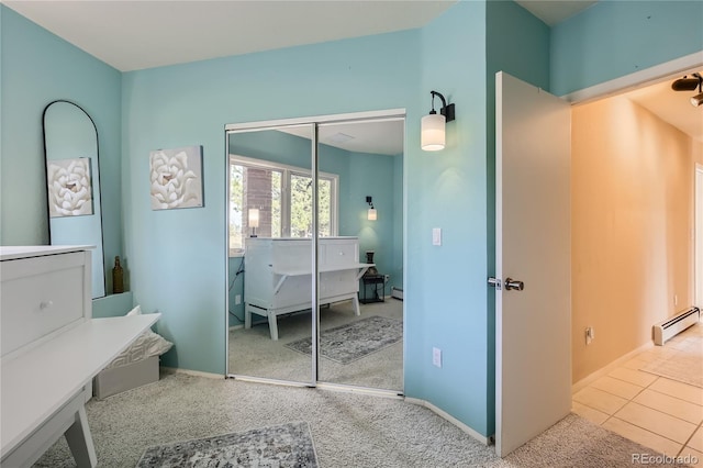 3001 Eagle Ridge Rd, Longmont, CO 80503 - carpeted bedroom featuring a baseboard radiator, a closet, baseboards, and a baseboard heating unit