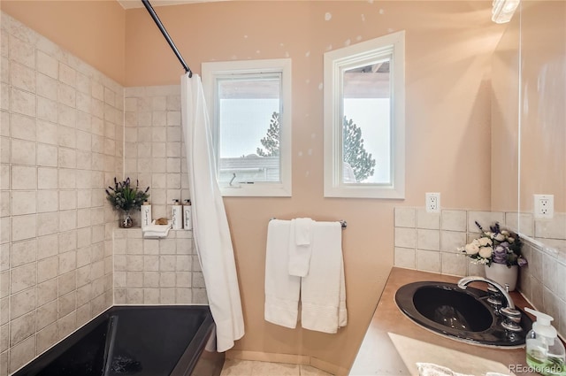 3001 Eagle Ridge Rd, Longmont, CO 80503 - bathroom featuring vanity, decorative backsplash, and shower / bath combination with curtain