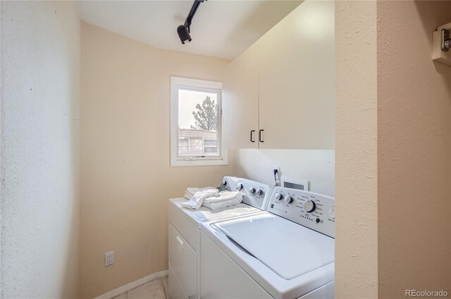 3001 Eagle Ridge Rd, Longmont, CO 80503 - laundry area featuring washer and dryer and cabinet space