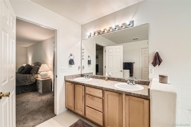20000 Mitchell Pl Unit 51, Denver, CO 80249 - ensuite bathroom featuring double vanity and tile patterned floors