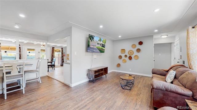 3067 S Holly Pl, Denver, CO 80222 - living room with wood finished floors, recessed lighting, and baseboards