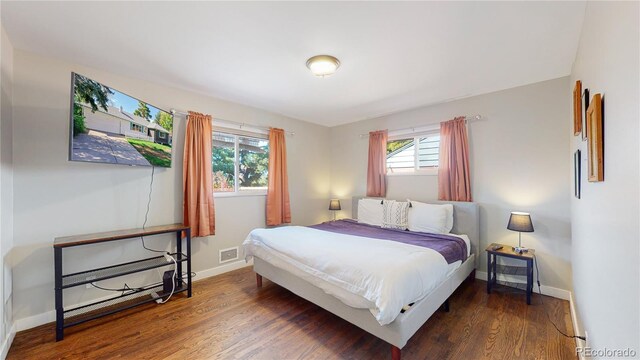 3067 S Holly Pl, Denver, CO 80222 - bedroom with wood finished floors and baseboards
