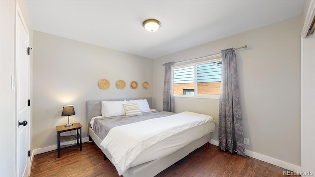 3067 S Holly Pl, Denver, CO 80222 - bedroom with dark wood-style floors and baseboards