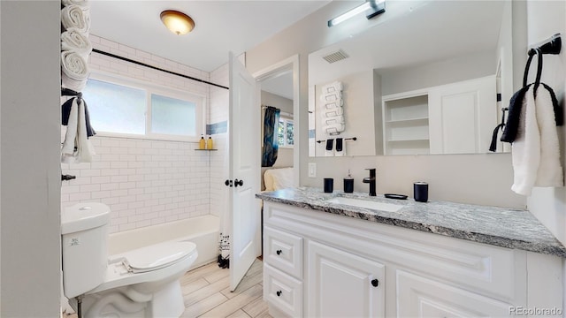 3067 S Holly Pl, Denver, CO 80222 - bathroom featuring vanity, toilet, shower / washtub combination, and wood finished floors
