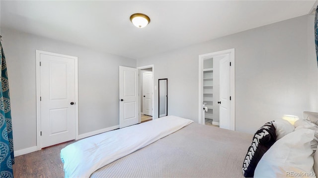 3067 S Holly Pl, Denver, CO 80222 - bedroom featuring wood finished floors and baseboards