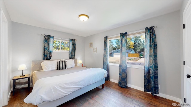 3067 S Holly Pl, Denver, CO 80222 - bedroom featuring baseboards and wood finished floors