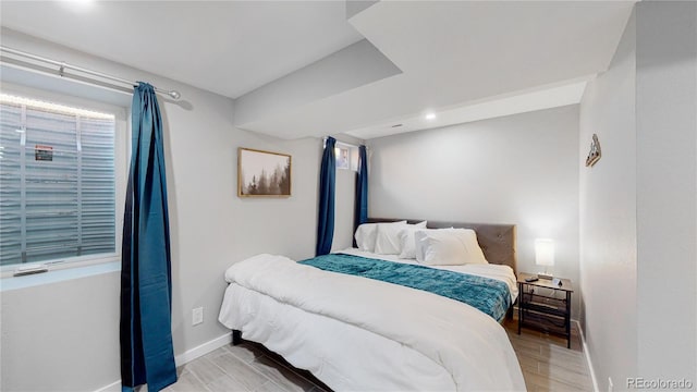 3067 S Holly Pl, Denver, CO 80222 - bedroom featuring baseboards and light wood-style flooring