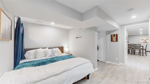3067 S Holly Pl, Denver, CO 80222 - bedroom with light wood finished floors, baseboards, and recessed lighting