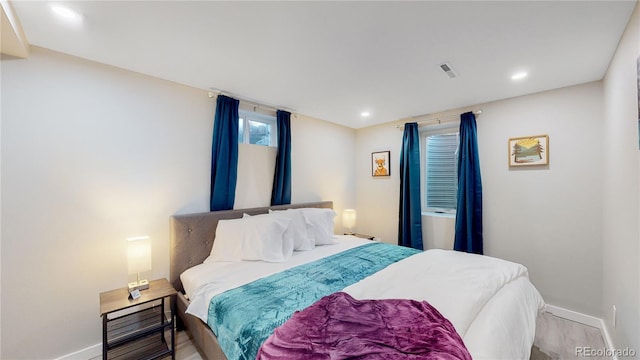 3067 S Holly Pl, Denver, CO 80222 - bedroom with baseboards, light wood finished floors, and recessed lighting