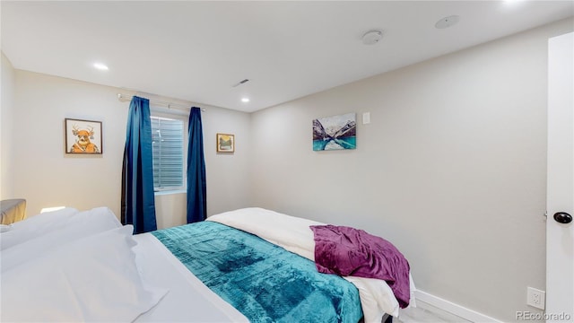 3067 S Holly Pl, Denver, CO 80222 - bedroom with baseboards, recessed lighting, and wood finished floors