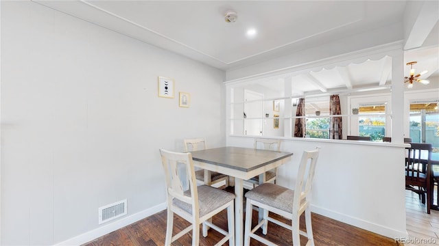 3067 S Holly Pl, Denver, CO 80222 - dining area with wood finished floors, baseboards, and plenty of natural light