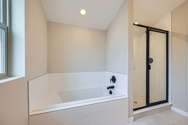 6926 Kendrick Ln, Arvada, CO 80007 - full bathroom featuring tile patterned floors, a shower stall, and a bath