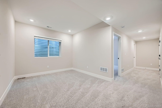 6926 Kendrick Ln, Arvada, CO 80007 - empty room with light colored carpet, baseboards, and visible vents
