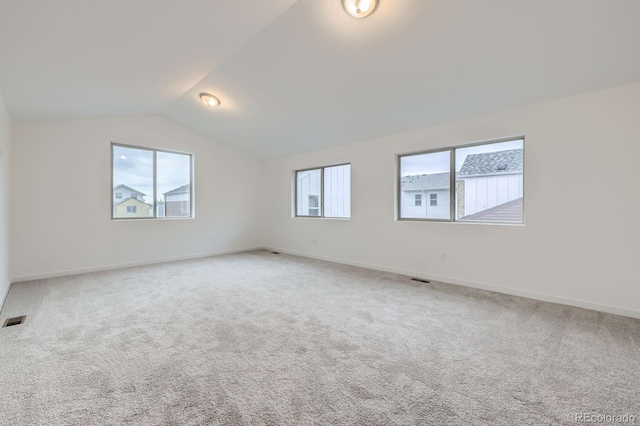 6926 Kendrick Ln, Arvada, CO 80007 - carpeted spare room featuring vaulted ceiling and baseboards