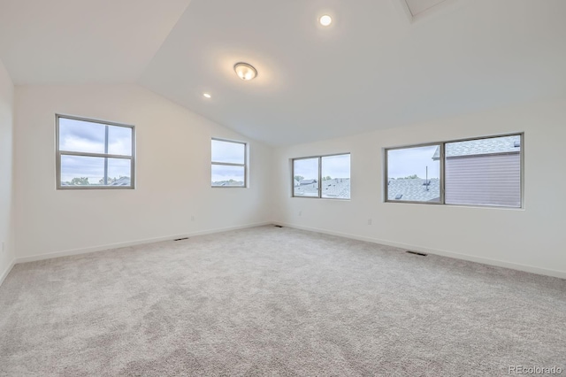 6926 Kendrick Ln, Arvada, CO 80007 - spare room featuring lofted ceiling, light colored carpet, and recessed lighting