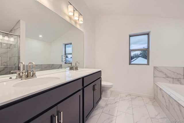 6926 Kendrick Ln, Arvada, CO 80007 - bathroom with marble finish flooring, plenty of natural light, double vanity, a bath, and lofted ceiling