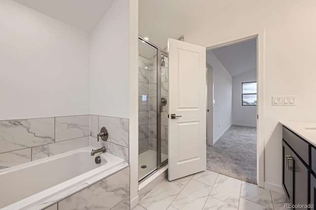 6926 Kendrick Ln, Arvada, CO 80007 - bathroom with marble look tiles, vanity, a marble finish shower, a bath, and vaulted ceiling