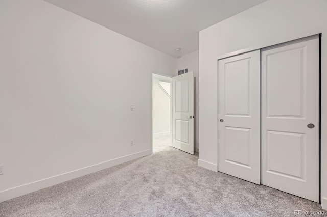 6926 Kendrick Ln, Arvada, CO 80007 - unfurnished bedroom featuring light colored carpet and a closet