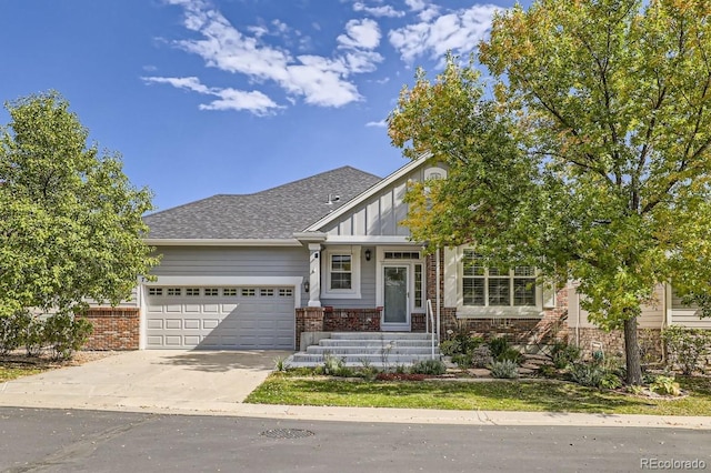 view of front of property featuring an attached garage, brick siding, concrete driveway, roof with shingles, and board and batten siding