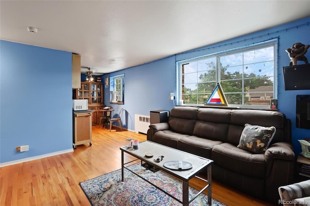 living room featuring light hardwood / wood-style flooring and radiator heating unit