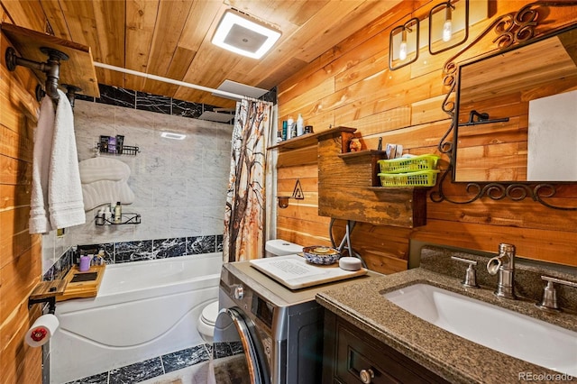 bathroom with wood ceiling, washer / clothes dryer, vanity, wooden walls, and shower / tub combo with curtain