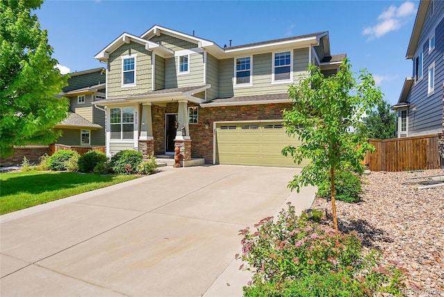 5722 S Flat Rock Way, Aurora, CO 80016 - craftsman-style home with concrete driveway, an attached garage, and stone siding