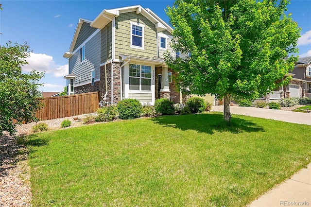 5722 S Flat Rock Way, Aurora, CO 80016 - view of front facade with stone siding, concrete driveway, and a garage