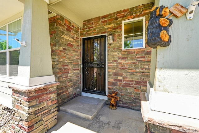 5722 S Flat Rock Way, Aurora, CO 80016 - property entrance featuring brick siding and covered porch