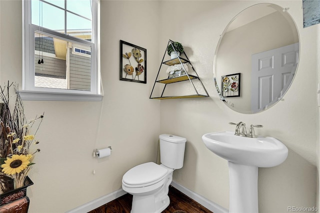 5722 S Flat Rock Way, Aurora, CO 80016 - half bath featuring baseboards and wood finished floors
