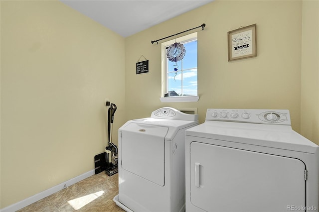 5722 S Flat Rock Way, Aurora, CO 80016 - laundry area with washer and clothes dryer and light tile patterned floors