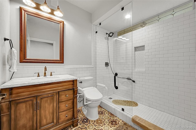 5722 S Flat Rock Way, Aurora, CO 80016 - full bathroom featuring tile walls, a tile shower, vanity, wainscoting, and tile patterned flooring