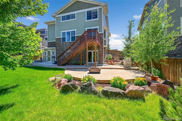 5722 S Flat Rock Way, Aurora, CO 80016 - back of house with a patio, stairs, stone siding, and a fire pit