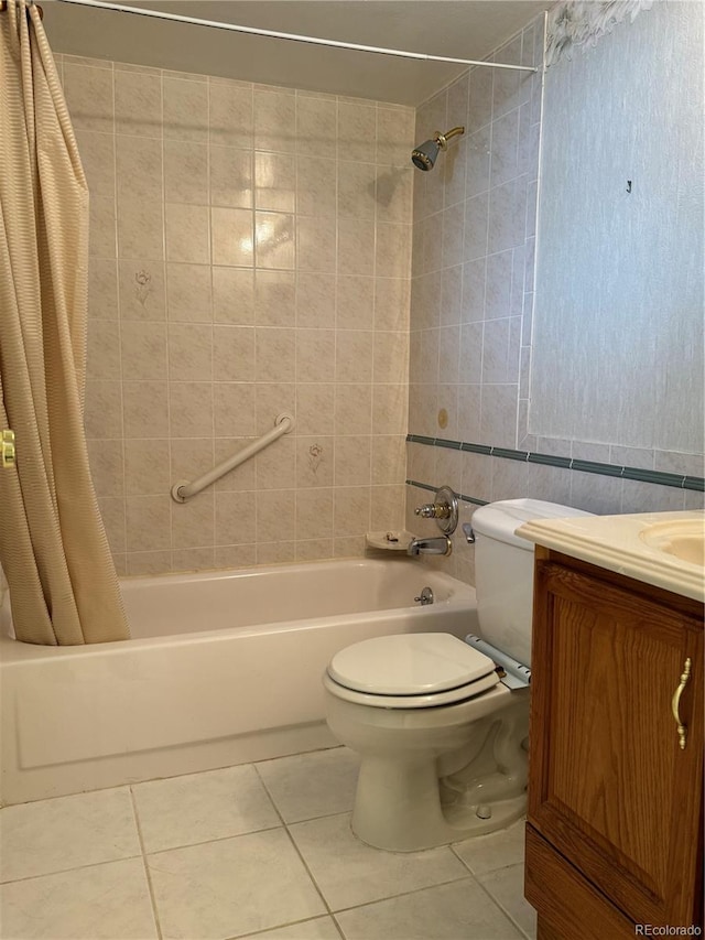 full bathroom featuring shower / bath combo, tile patterned flooring, toilet, vanity, and tile walls