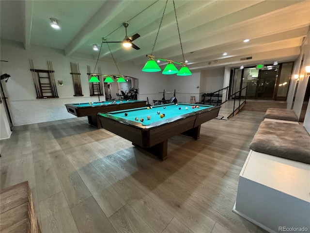 recreation room featuring beamed ceiling, light hardwood / wood-style flooring, ceiling fan, and pool table