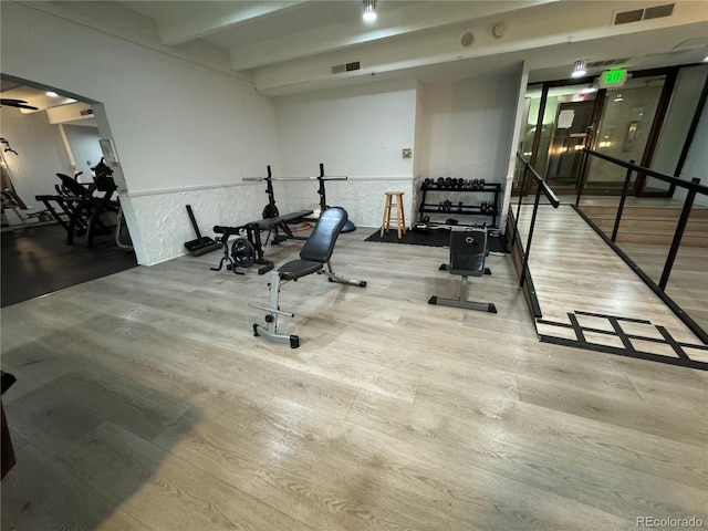 workout room featuring hardwood / wood-style floors