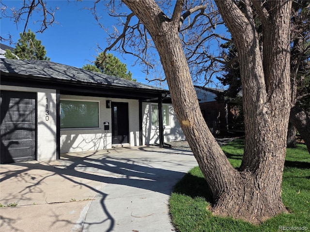 1130 S Harrison St, Denver, CO 80210 - single story home with driveway and brick siding