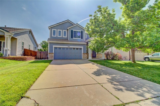 8416 S Reed St, Littleton, CO 80128 - view of front of house featuring brick siding, an attached garage, and driveway