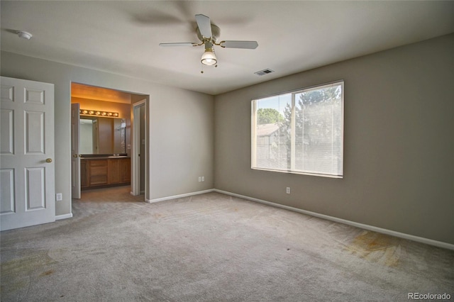8416 S Reed St, Littleton, CO 80128 - unfurnished bedroom featuring carpet, baseboards, ensuite bathroom, and a ceiling fan