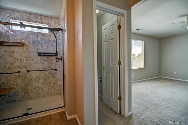 8416 S Reed St, Littleton, CO 80128 - bathroom with a marble finish shower, ceiling fan, and baseboards