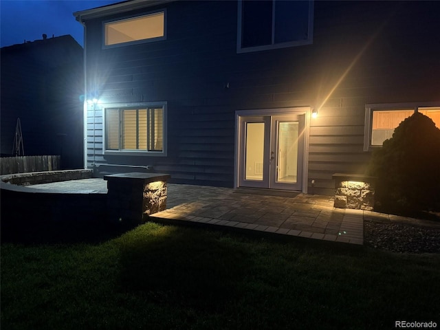 8416 S Reed St, Littleton, CO 80128 - back of house at twilight with a patio area