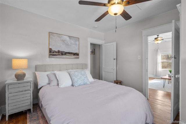 bedroom featuring dark hardwood / wood-style floors and ceiling fan