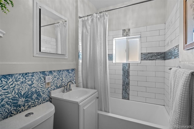 full bathroom featuring vanity, toilet, and shower / bath combo with shower curtain