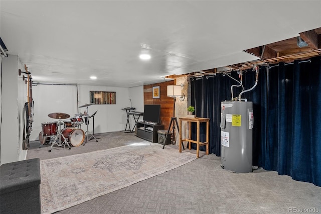 basement featuring light carpet and electric water heater