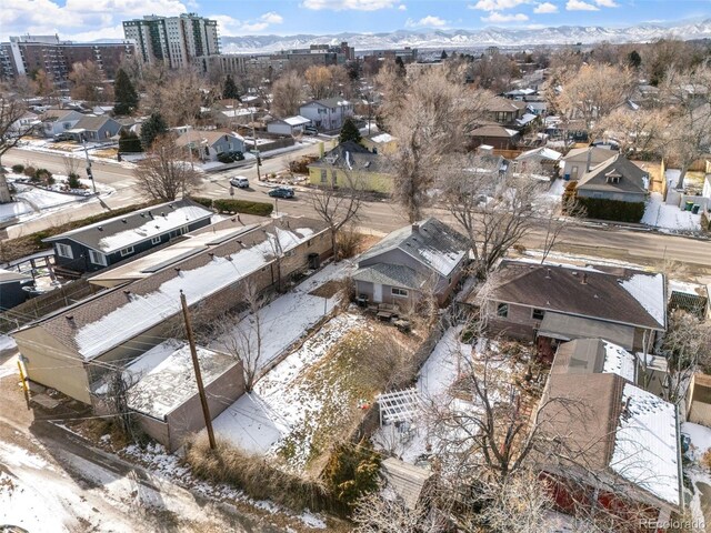 birds eye view of property with a mountain view