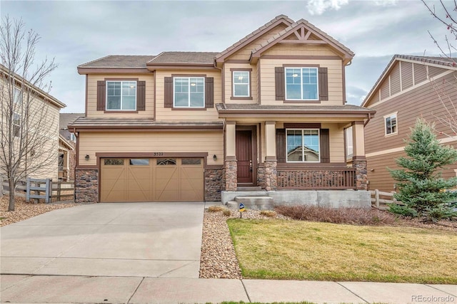 3522 Harvard Pl, Broomfield, CO 80023 - craftsman-style home with fence, an attached garage, a front lawn, concrete driveway, and covered porch
